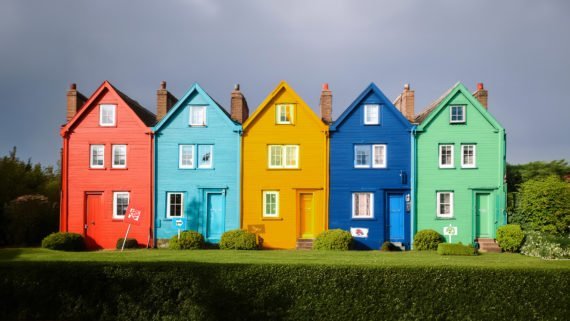 5 houses with each of the homes being a different UK political party.